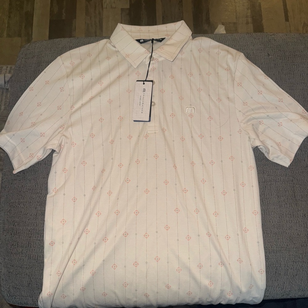 Travis Mathew Cream Polo with Subtle Pattern
